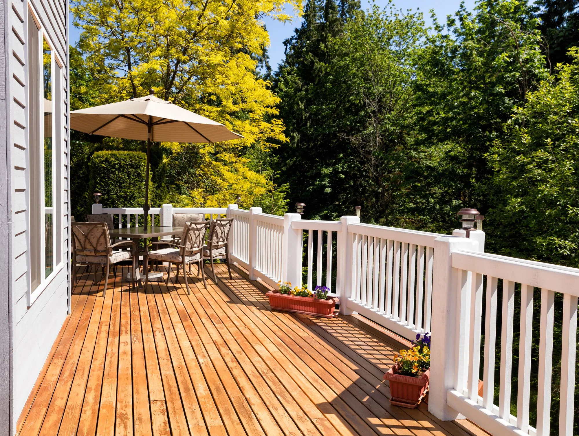 Wood deck and patio area built for backyard gathering space